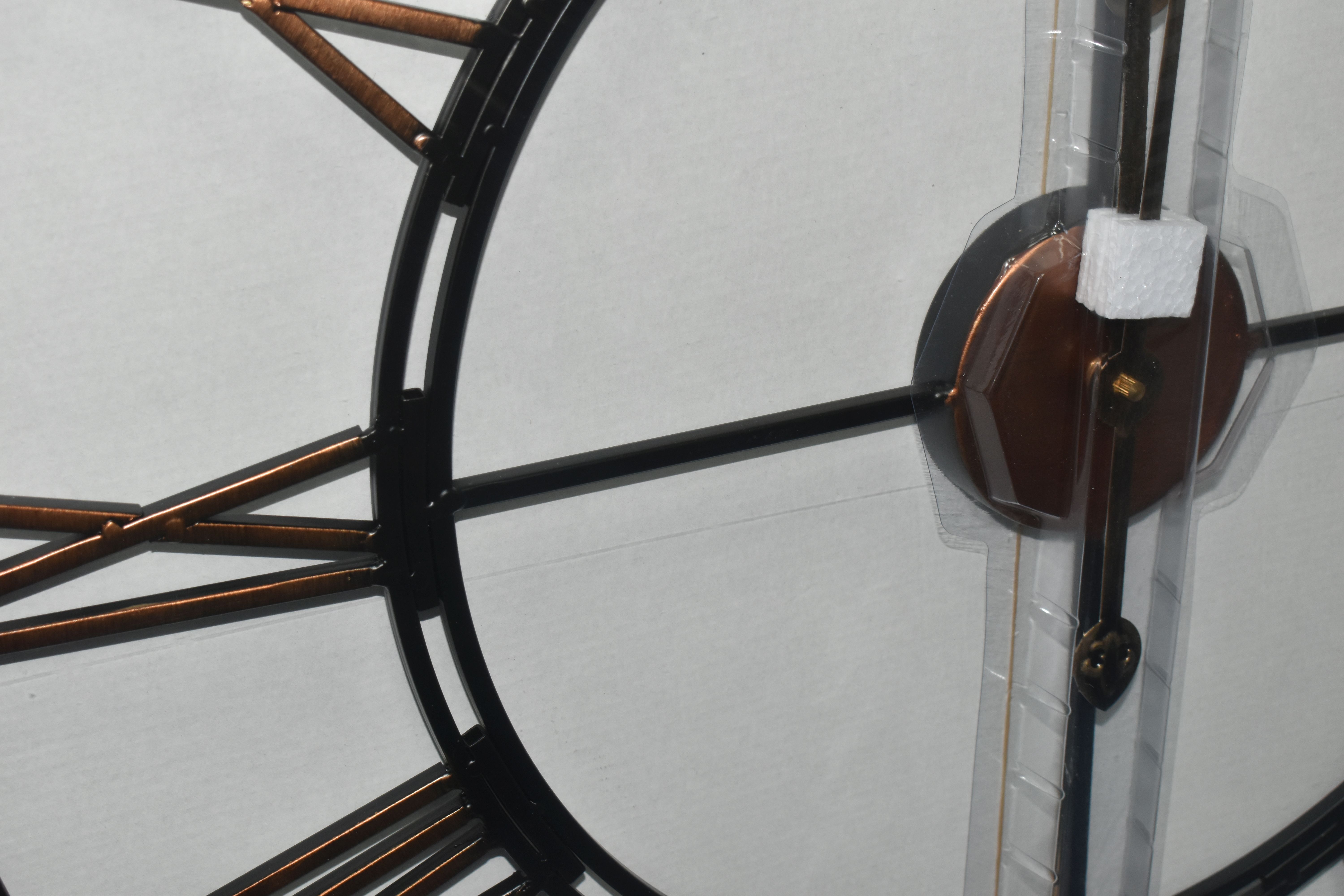 A BOXED 'LIBRA' UNUSED WALL CLOCK, a black and bronze coloured metal wall clock with Roman numerals, - Image 2 of 2