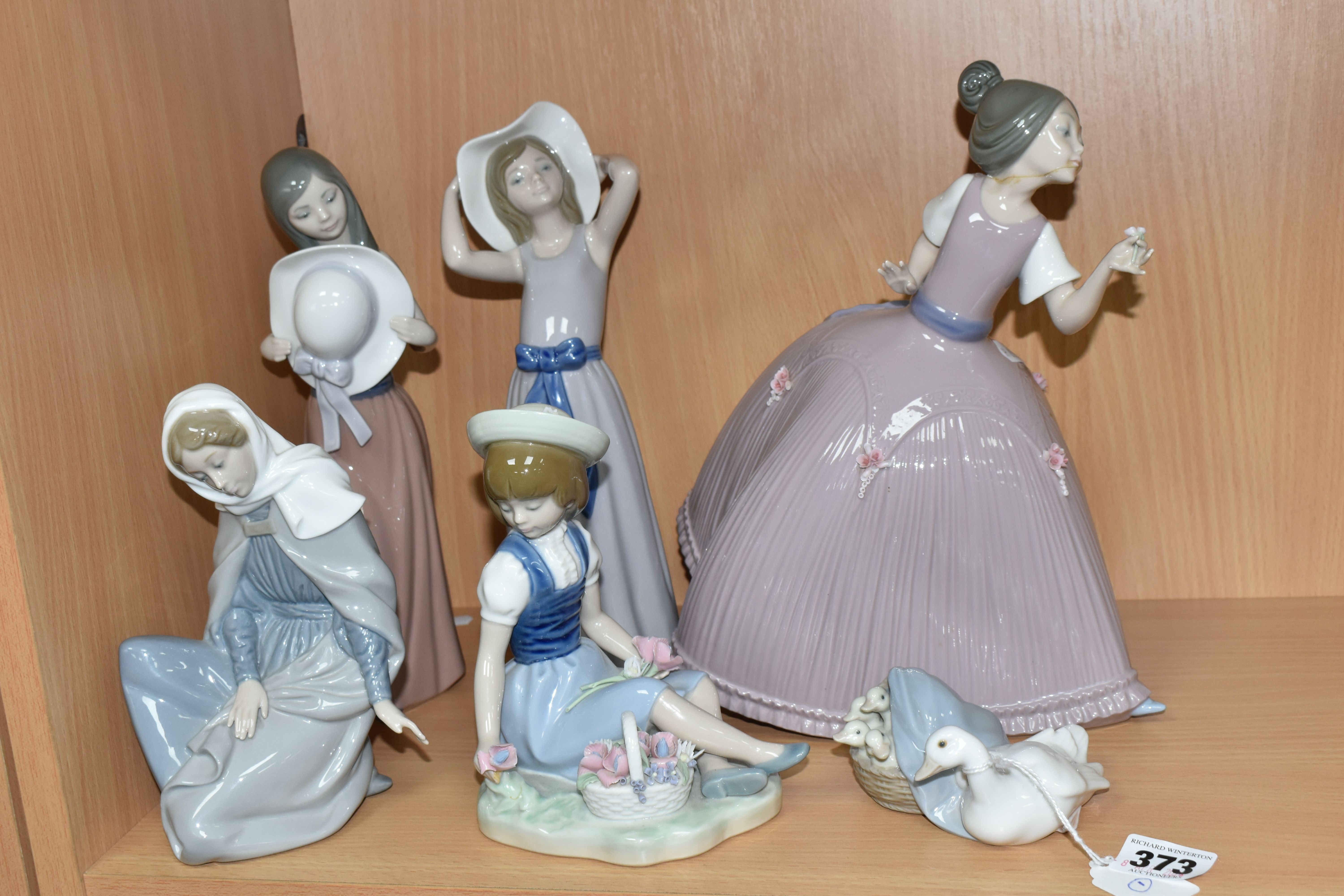 A GROUP OF SIX LLADRO AND NAO FIGURES, comprising 5120 'Girl In Pink Dress' (cracked and reglued