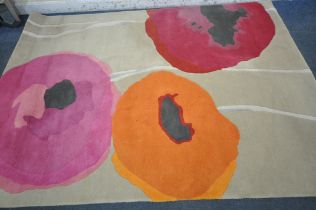 A SANDERSON WOOLEN RUG, with POPPIES-red/orange 45700 design 280cm x 200cm, along with a Made.com