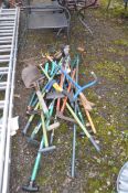 A COLLECTION OF GARDEN TOOLS including rakes, shovels, bolt croppers , edging tools etc
