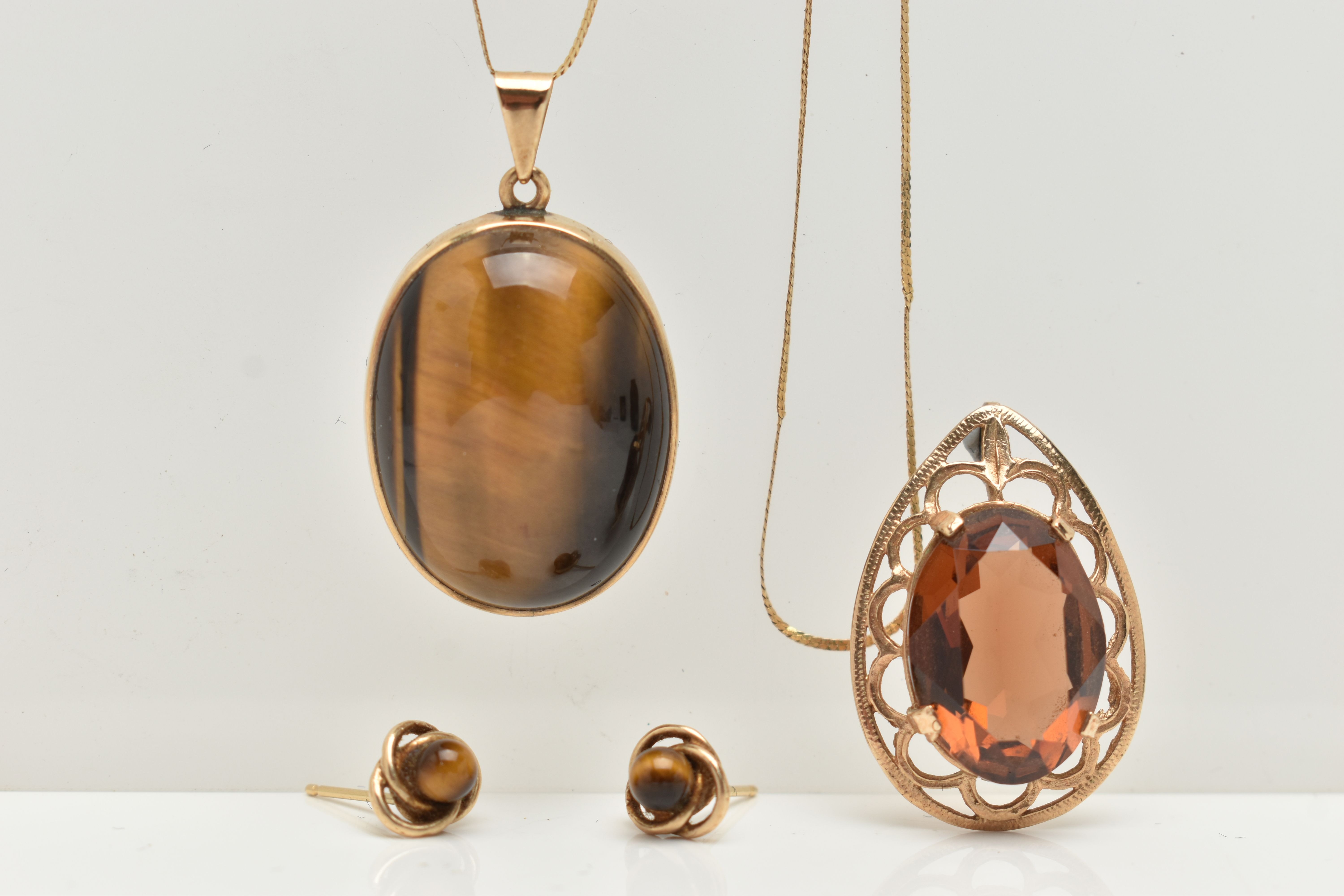 A TIGERS EYE PENDANT NECKLACE AND EARRING SET AND A SMOKY QUARTZ PENDANT, a large oval tigers eye - Image 2 of 4