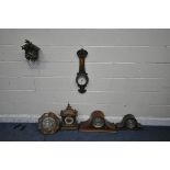 A 20TH CENTURY OAK MANTEL CLOCK, with three finials and brass mounts, another mantel clock, a mantel