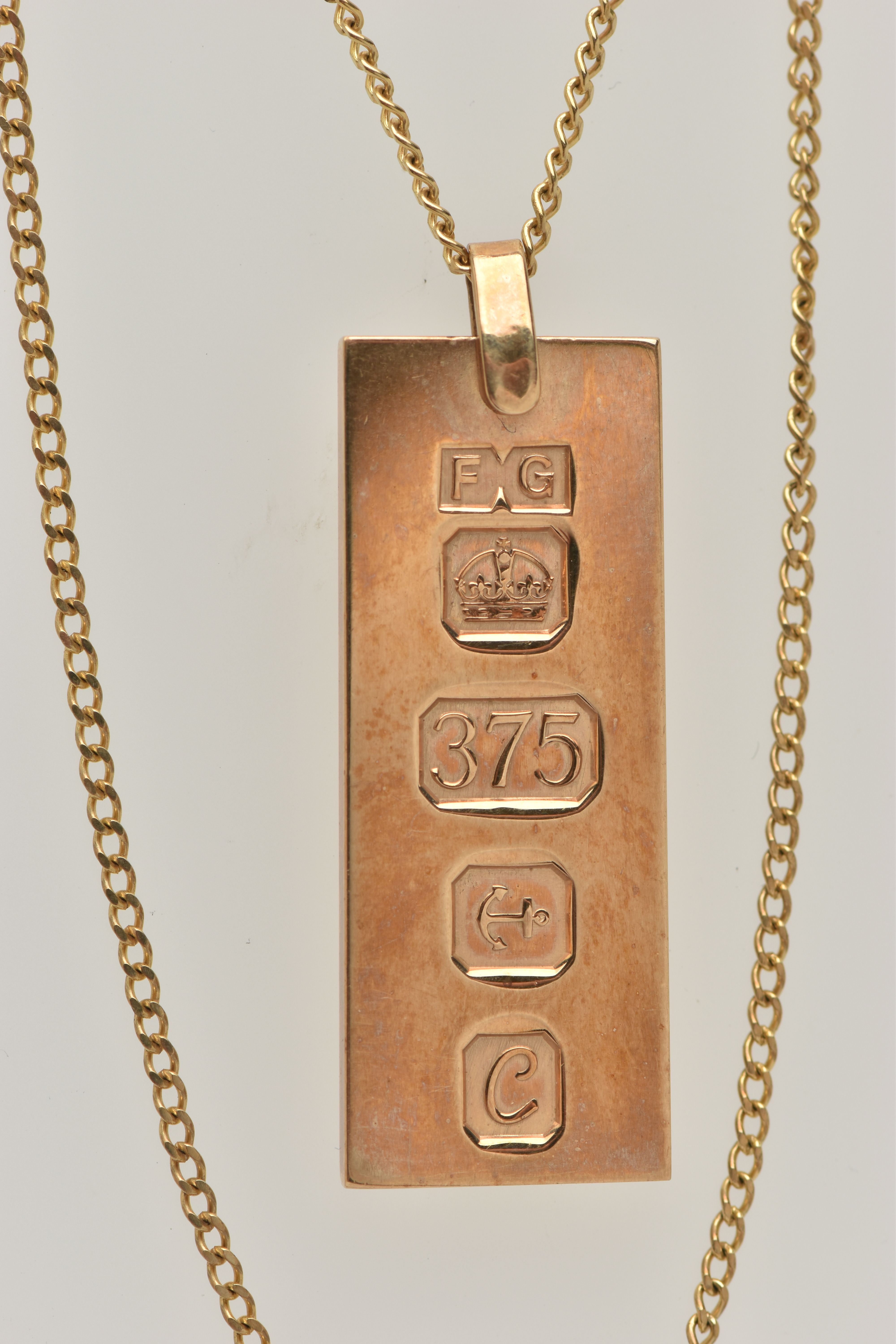 A 9CT GOLD INGOT PENDANT AND CHAIN, the rectangular pendant with large hallmark for Birmingham 1977, - Image 2 of 3