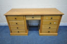 A HEAVY SOLID OAK DESK, fitted with five assorted drawers and a cupboard door, length 155cm x