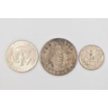 THREE COINS, to include a 1990 American quarter dollar, an 1964 half dollar and a 1909 Filipinas (