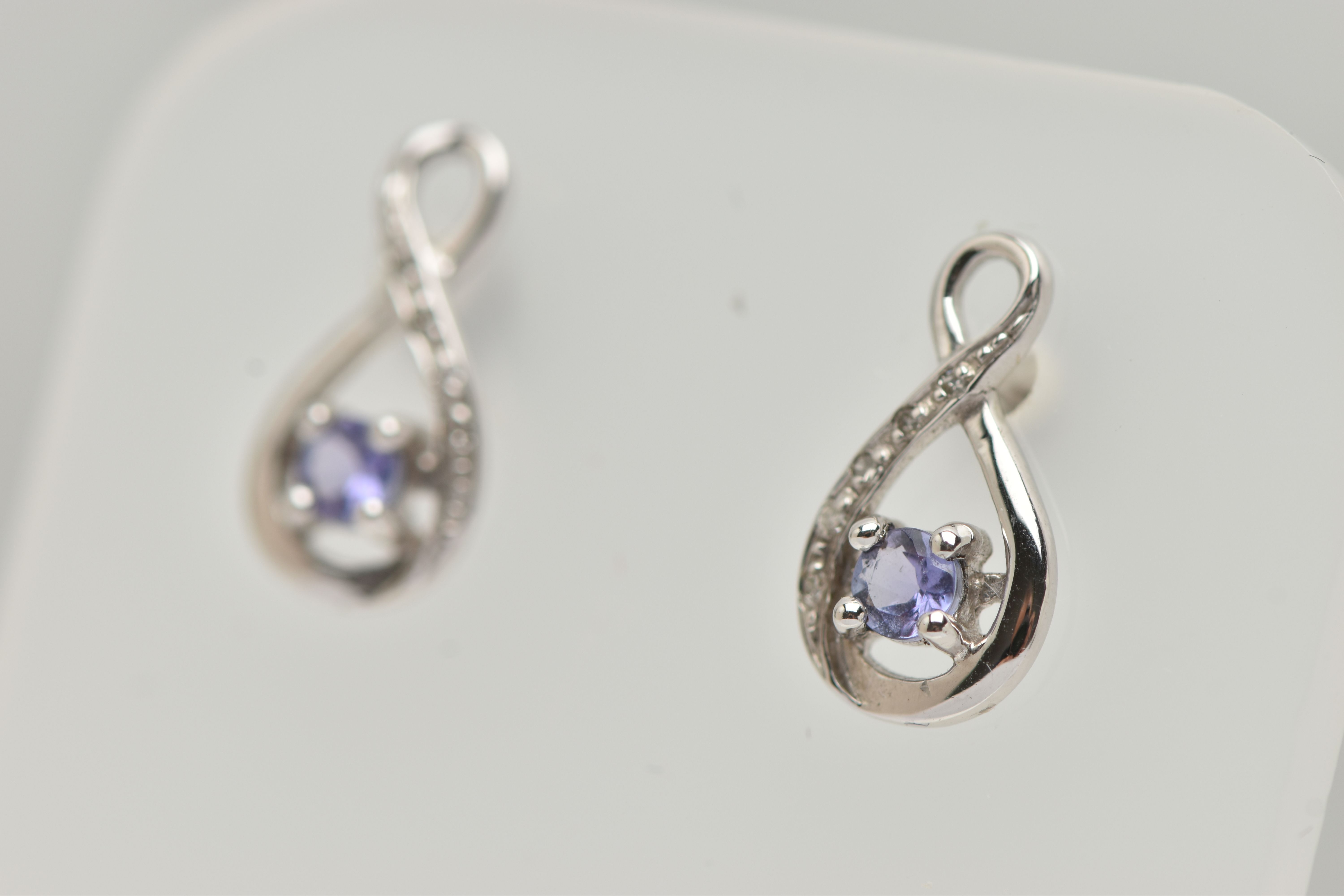 A BOXED PAIR OF 9CT WHITE GOLD TANZANITE AND DIAMOND SET EARRINGS, each earring set with a small - Image 3 of 3