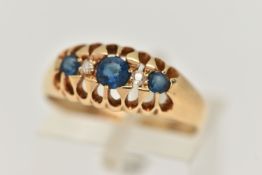 AN EARLY 20TH CENTURY, 18CT GOLD FIVE STONE RING, set with three circular cut blue paste,