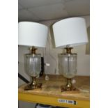 TWO MODERN TABLE LAMPS, with glass bodies and off white shades, height to top of fitting