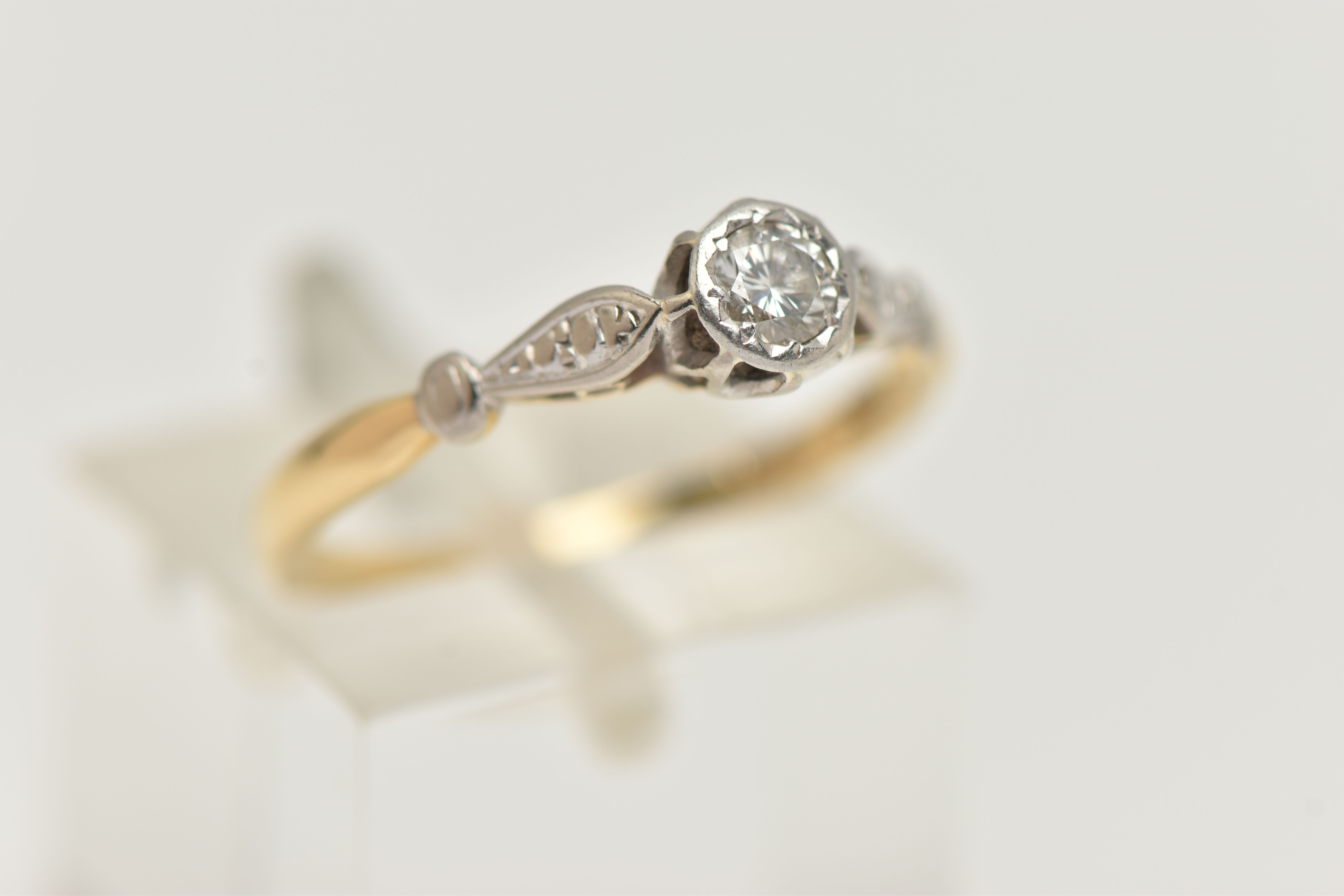 A YELLOW AND WHITE METAL DIAMOND SINGLE STONE RING, illusion set round brilliant cut diamond, - Image 4 of 4