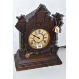 A AMERICAN MANTEL CLOCK, made by The Ansonia Clock Company - New York, a stained pine, striking gong