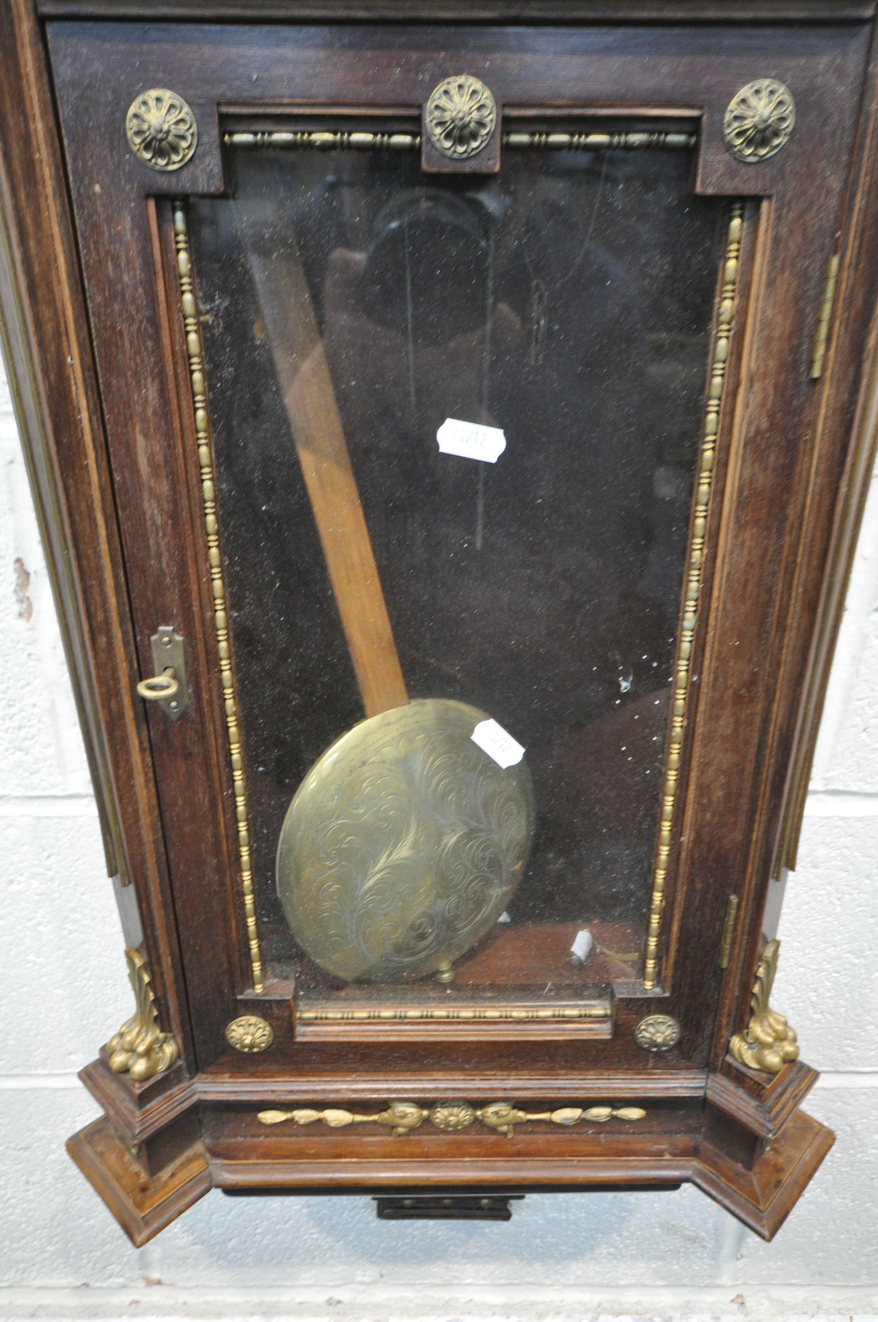 A 20TH CENTURY OAK CASED WALL CLOCK, with a variety of brass decorations, to include masks, ribbons, - Image 6 of 11