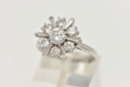 AN 18CT WHITE GOLD DIAMOND CLUSTER RING, centering on a round brilliant cut diamond, estimated