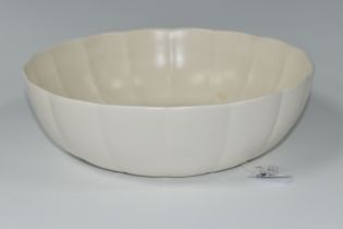A KEITH MURRAY DESIGN BOWL FOR WEDGWOOD, a cream fluted bowl, blue printed backstamp, diameter