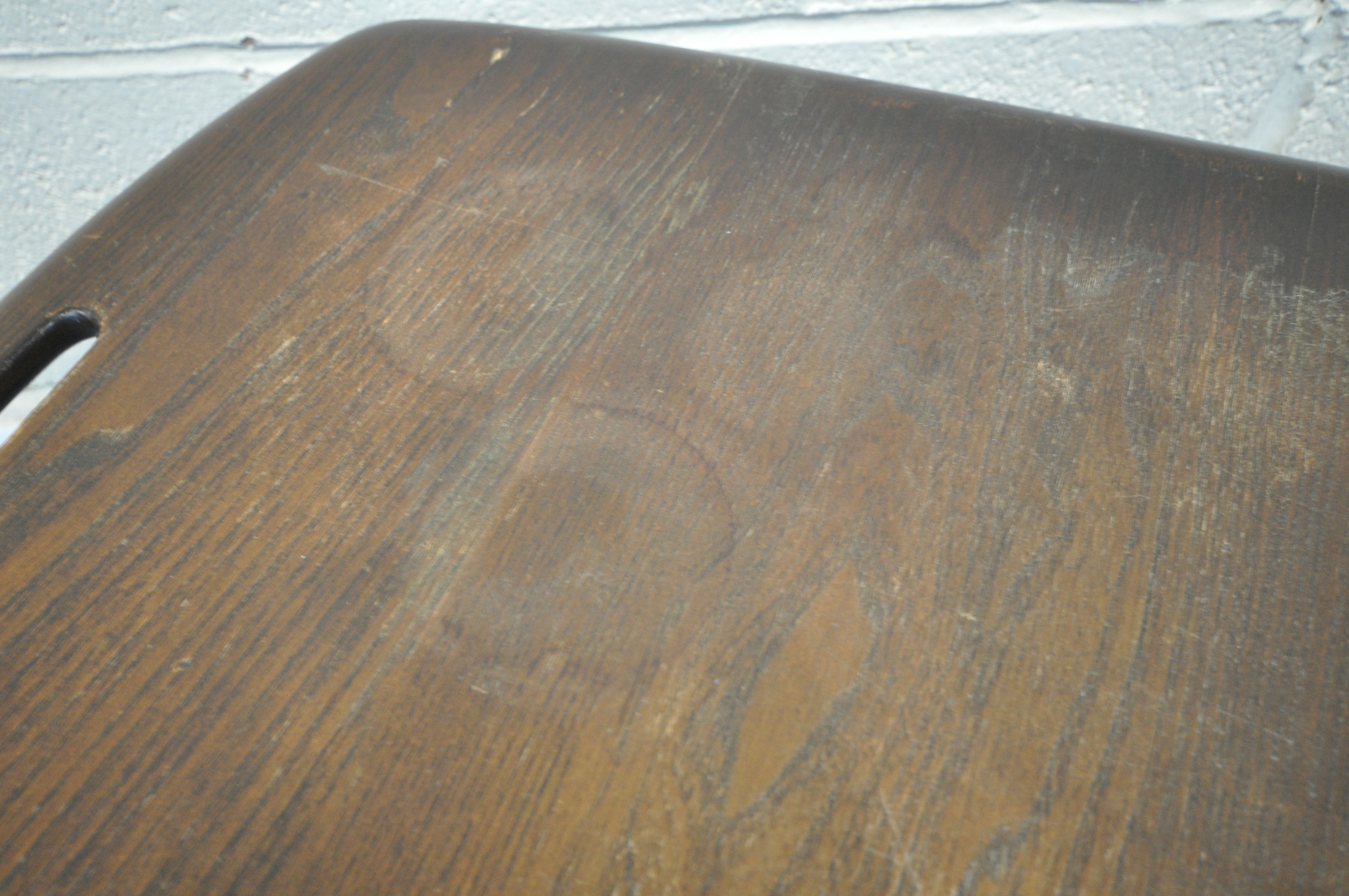 AN ELM AND BEECH DARK ERCOL TWO TIER BUTLERS TABLE, with twin handles, raised on cylindrical tapered - Image 3 of 3