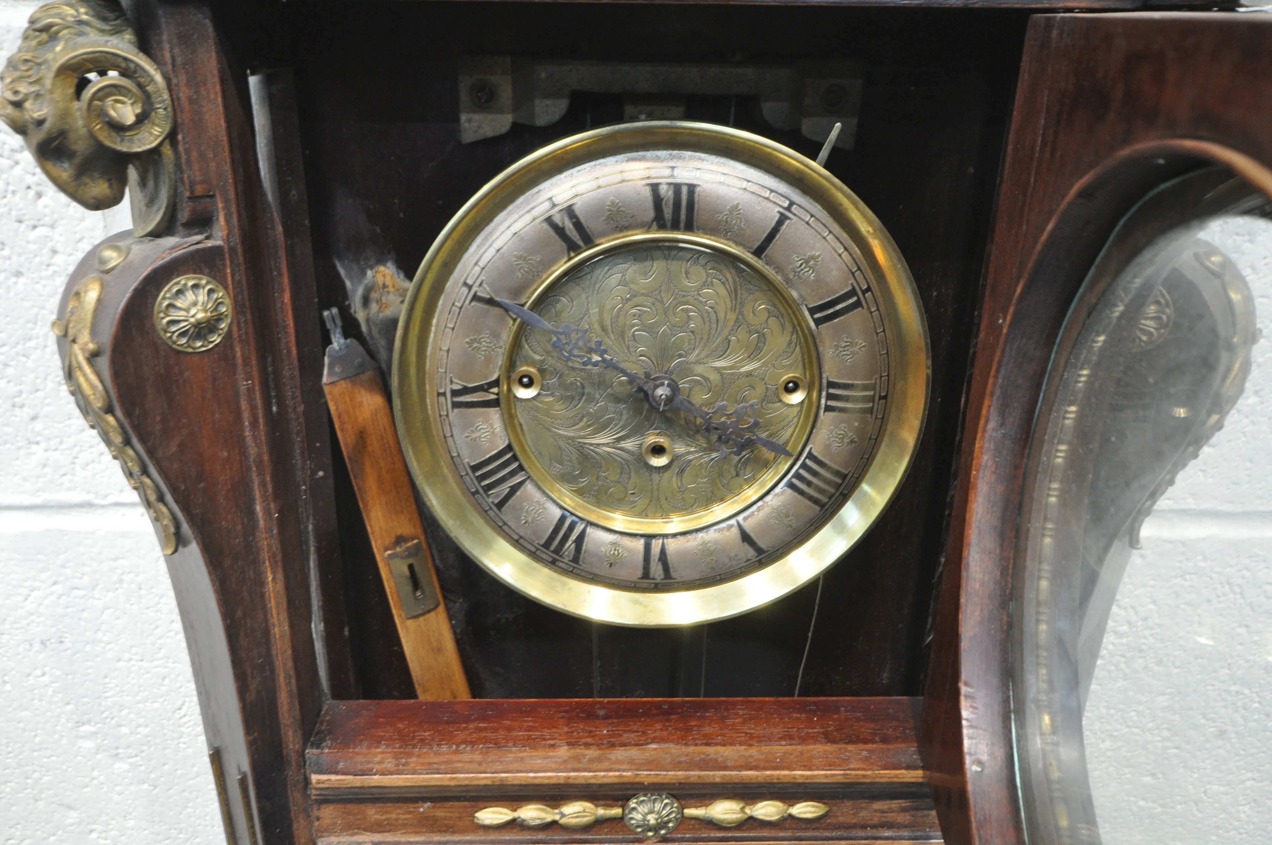 A 20TH CENTURY OAK CASED WALL CLOCK, with a variety of brass decorations, to include masks, ribbons, - Image 5 of 11