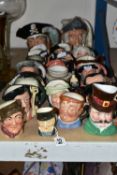 A COLLECTION OF TWENTY FOUR CHARACTER JUGS, PRIMARILY ROYAL DOULTON, the two large jugs comprising