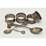 AN ASSORTMENT OF SILVER ITEMS, to include four silver napkin rings, a tea spoon, a spoon a thimble