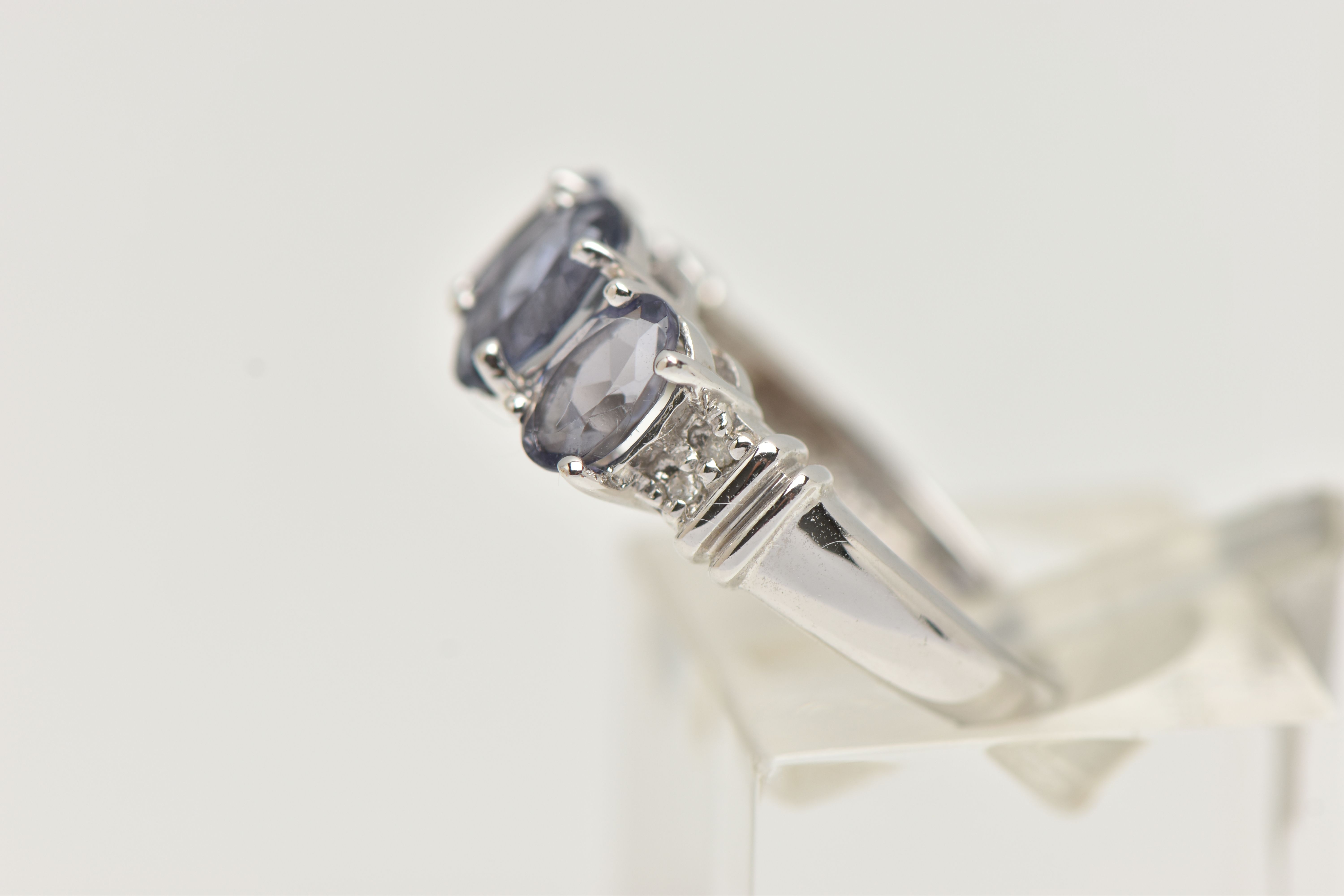 A 9CT WHITE GOLD TANZANITE RING, set with three oval cut tanzanite, each in a four claw setting, - Image 2 of 4