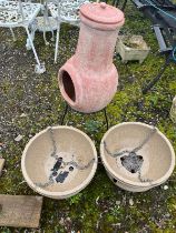 A MODERN CHIMINEA WITH STAND AND LID along with two plastic hanging baskets (3)
