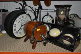 A GROUP OF ORNAMENTS, comprising two contemporary clocks, a boxed set of Cascada decorative spheres,