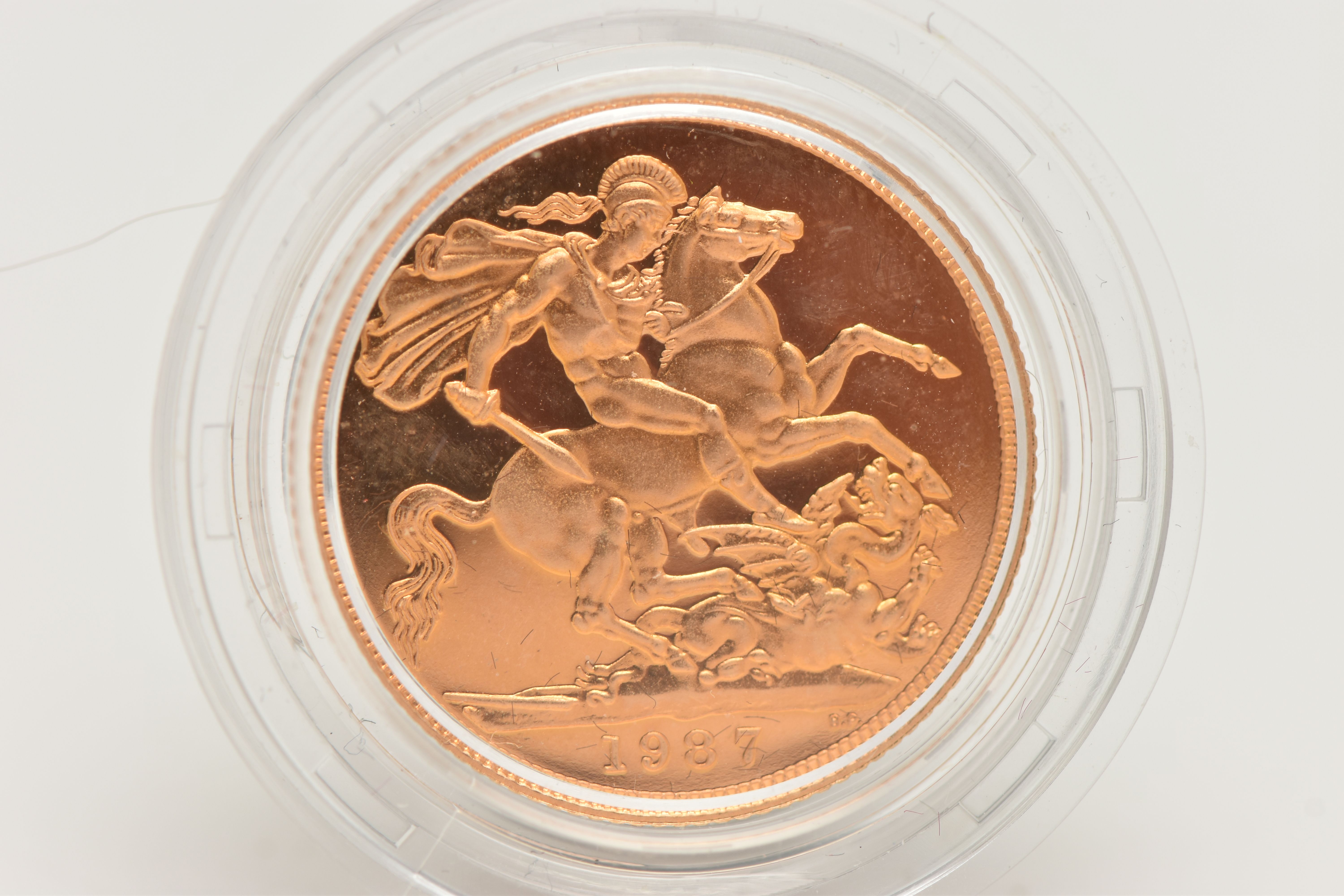 A 1987 GOLD PROOF FULL SOVEREIGN COIN, 22ct gold, 7.99 grams, 22.05mm diameter, in capsule (finger