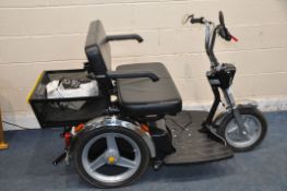 AN AFIKIM TWO SEAT TRICYCLE MOBILITY SCOOTER with charger, one key, rear basket, lights and