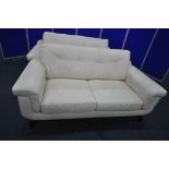 A PAIR OF DEBENHAMS TWO SEATER SOFAS, with soul white leather upholstery, length 184cm x depth 100cm