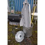 A COLLECTION OF GARDEN TOOLS AND A BARBECUE including a galvanised fire bin, a parasol with stand,