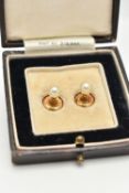 A PAIR OF YELLOW METAL AND CULTURED PEARL DRESS STUDS, each fitted with a white cultured pearl,