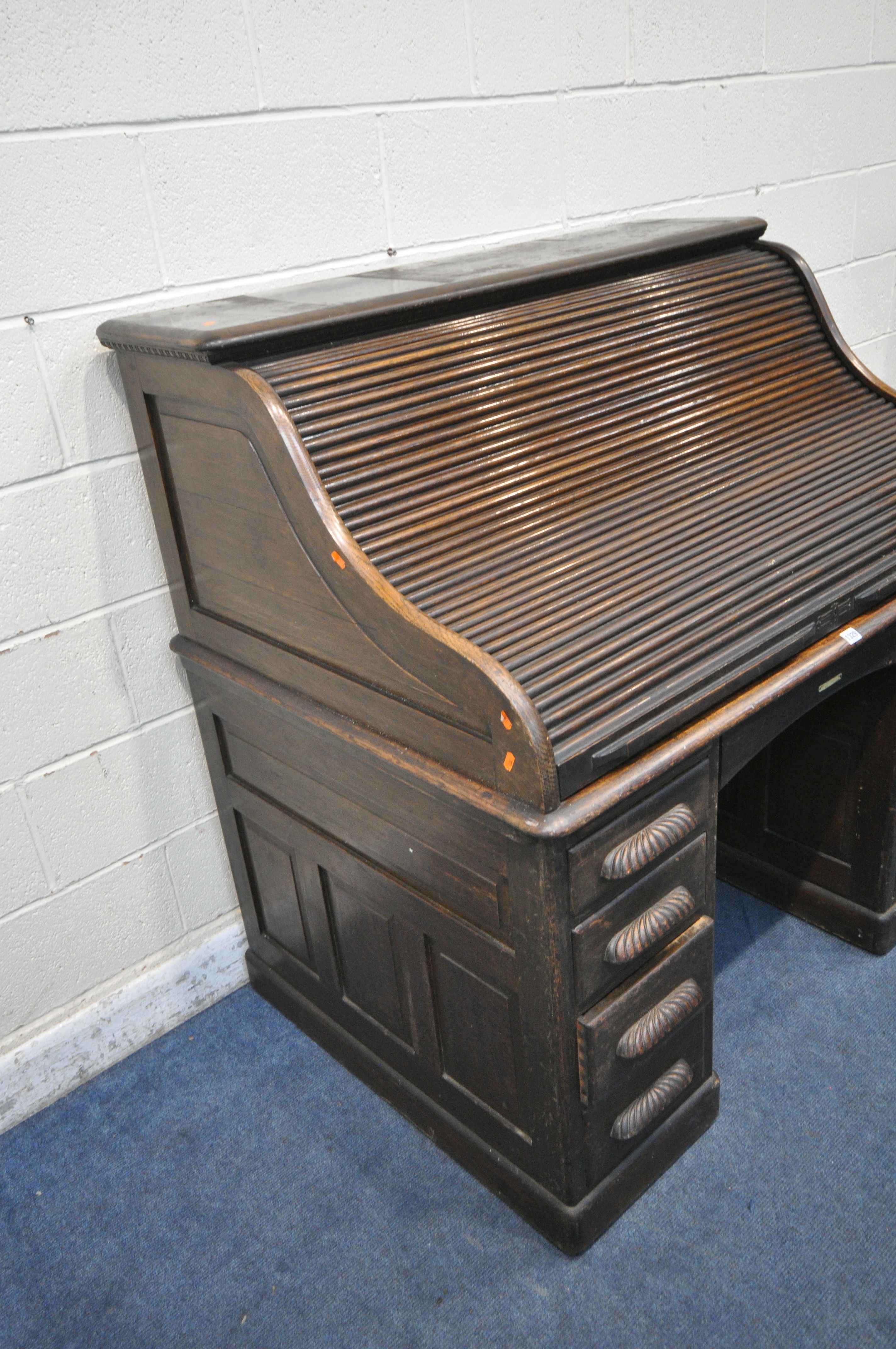 AN EARLY 20TH CENTURY OAK ROLL TOP DESK, enclosing a fitted interior, on two pedestals, each with - Image 2 of 8