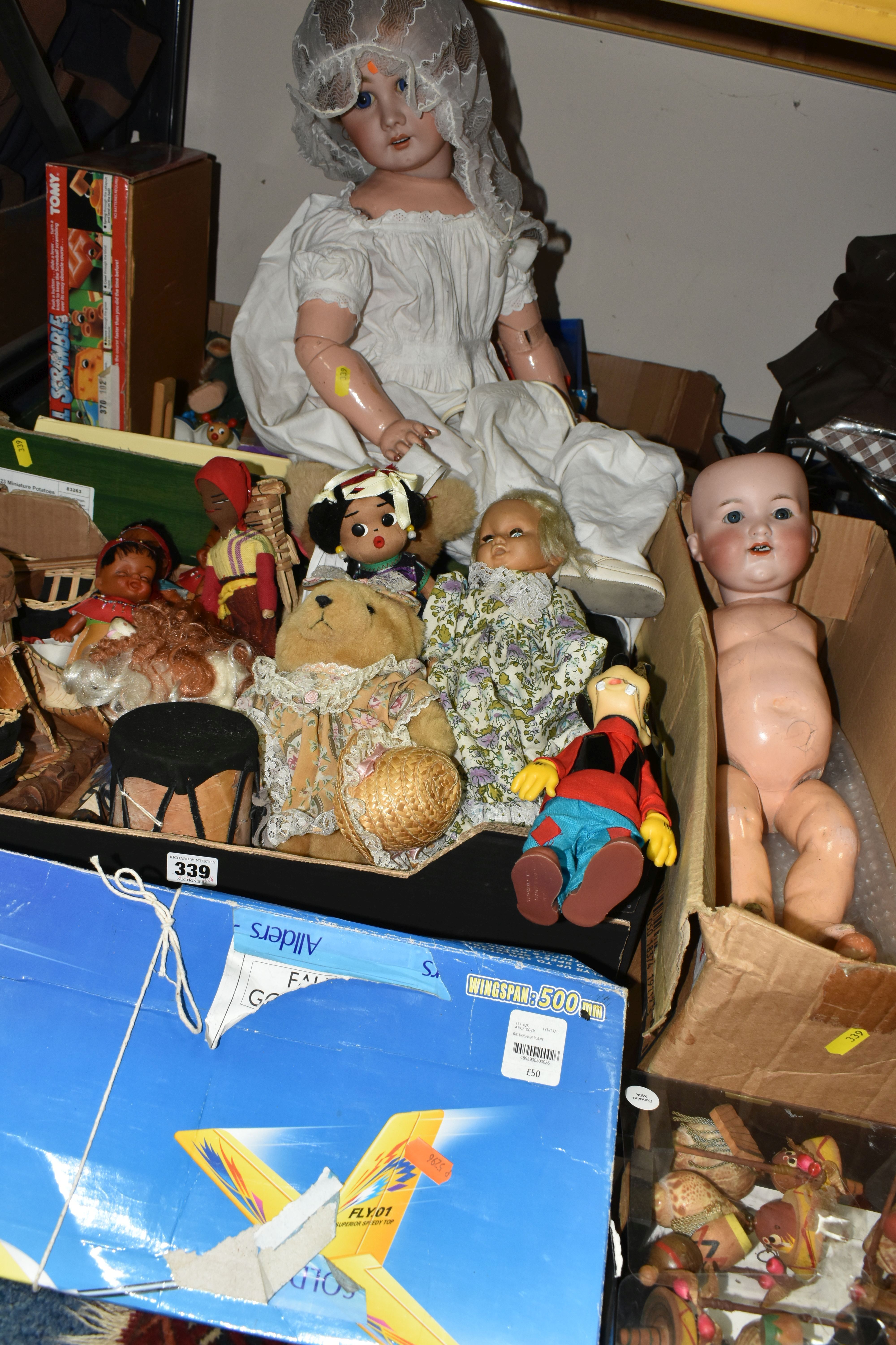 THREE BOXES OF VINTAGE TOYS, DOLLS AND GAMES, to include a porcelain doll with composite body,