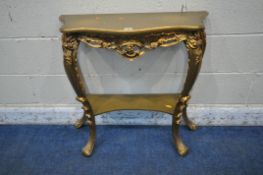 AN ITALIAN STYLE GILT CONSOLE TABLE, with shaped top, scrolled and foliate decoration, on cabriole