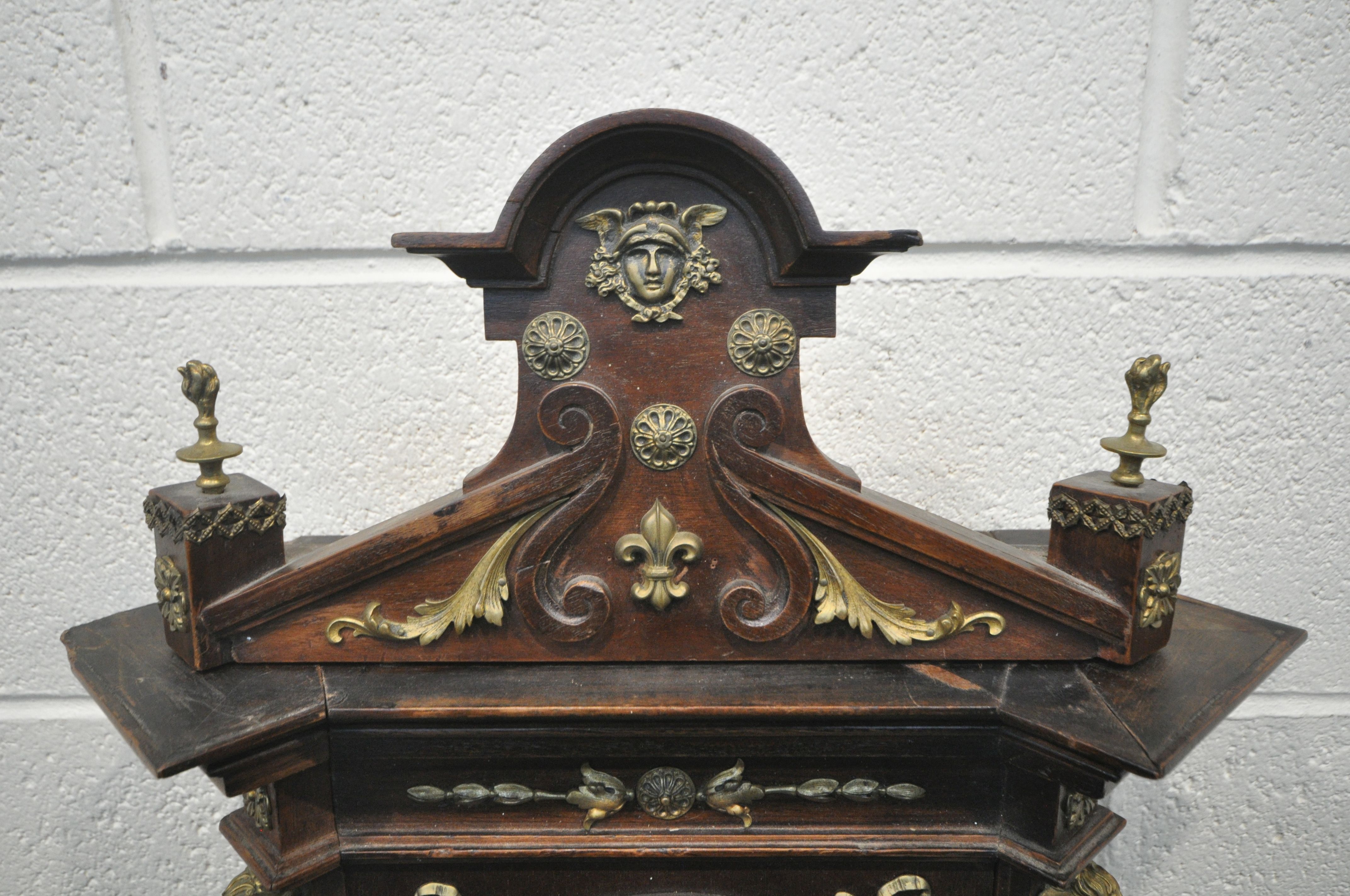 A 20TH CENTURY OAK CASED WALL CLOCK, with a variety of brass decorations, to include masks, ribbons, - Image 2 of 11