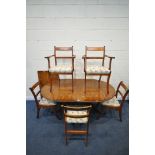 A 20TH CENTURY YEW WOOD OVAL TWIN PEDESTAL DINING TABLE, with a single additional leaf, length 161cm