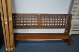 A HARDWOOD 6FT BEDSTEAD, with side rails and pine slats (condition report: scuffs and scratches)