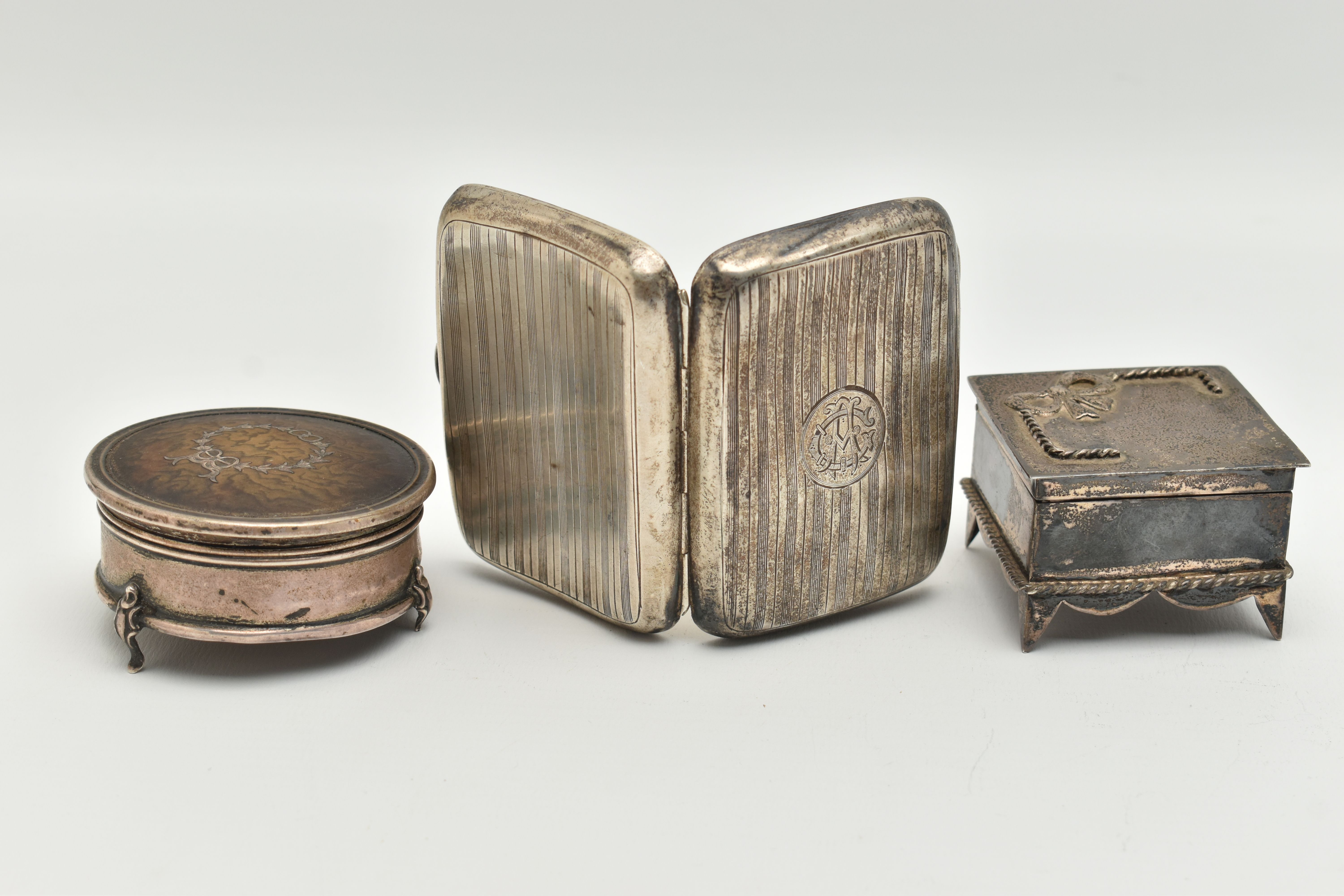 A SILVER CIGARETTE CASE AND TWO TRINKET BOXES, rounded rectangular cigarette case with engine turned