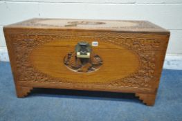 A 20TH CENTURY CAMPHORWOOD BLANKET CHEST, with detailed carving, depicting, ships, dragons, etc,