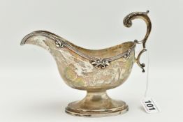 A GEORGE V SILVER GRAVY BOAT, polished form, textured rim with floral detail, on an oval base with