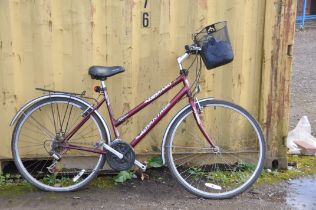 A TERRANO ADVANTAGE LADIES BIKE with 21 speed Shimano gears, front basket, rear rack 21in frame