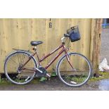A TERRANO ADVANTAGE LADIES BIKE with 21 speed Shimano gears, front basket, rear rack 21in frame