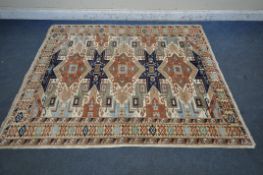 A PERSIAN WOOLEN RUG, with multi-coloured repeating geometric patterns and a multi-strap border,