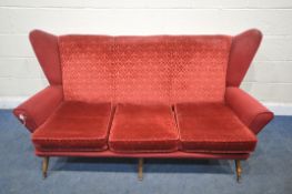 A 20TH CENTURY RED UPHOLSTERED WING BACK SOFA, on cylindrical tapered legs, length 175cm x depth