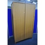 AN ERCOL SAVONA OAK TWO DOOR WARDROBE, enclosing an internal mirror to the right door, and a