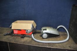 A 'THE BOSS' PULL ALONG VACUUM CLEANER in original box (PAT pass and working)