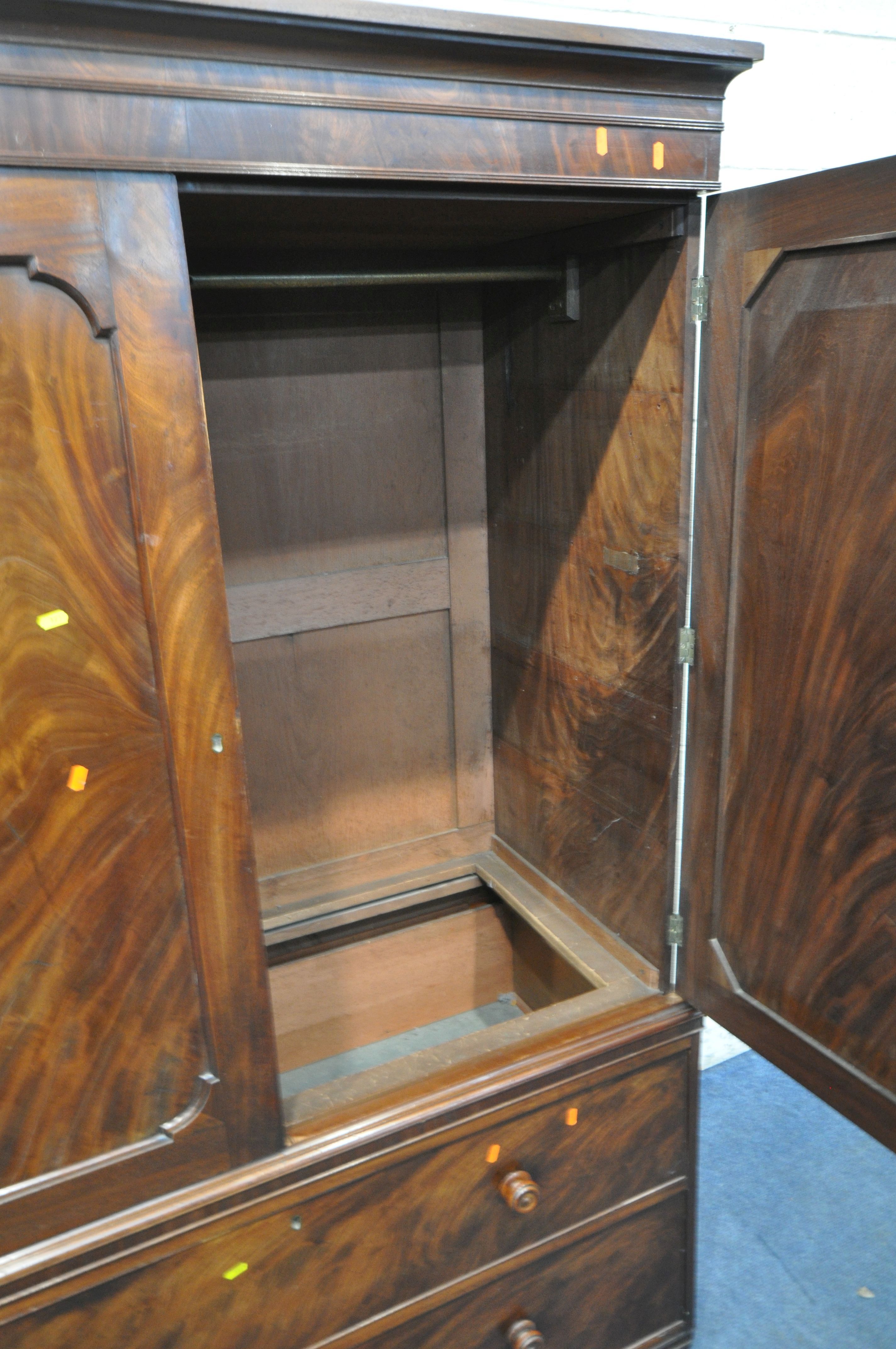 A 19TH CENTURY MAHOGANY LINEN PRESS, fitted with double cupboard doors, above two drawers, width - Image 2 of 4