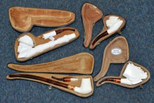 A BOX OF CASED REPRODUCTION MEERSCHAUM PIPES, comprising cased pipes in the forms of a mastiff