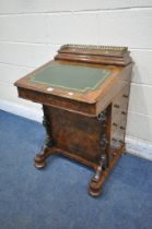 A VICTORIAN WALNUT DAVENPORT, with a raised gallery back, a small hinged compartment and a larger