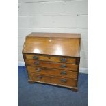 A GEORGIAN MAHOGANY BUREAU, the fall front door enclosing a fitted interior, above four drawers,