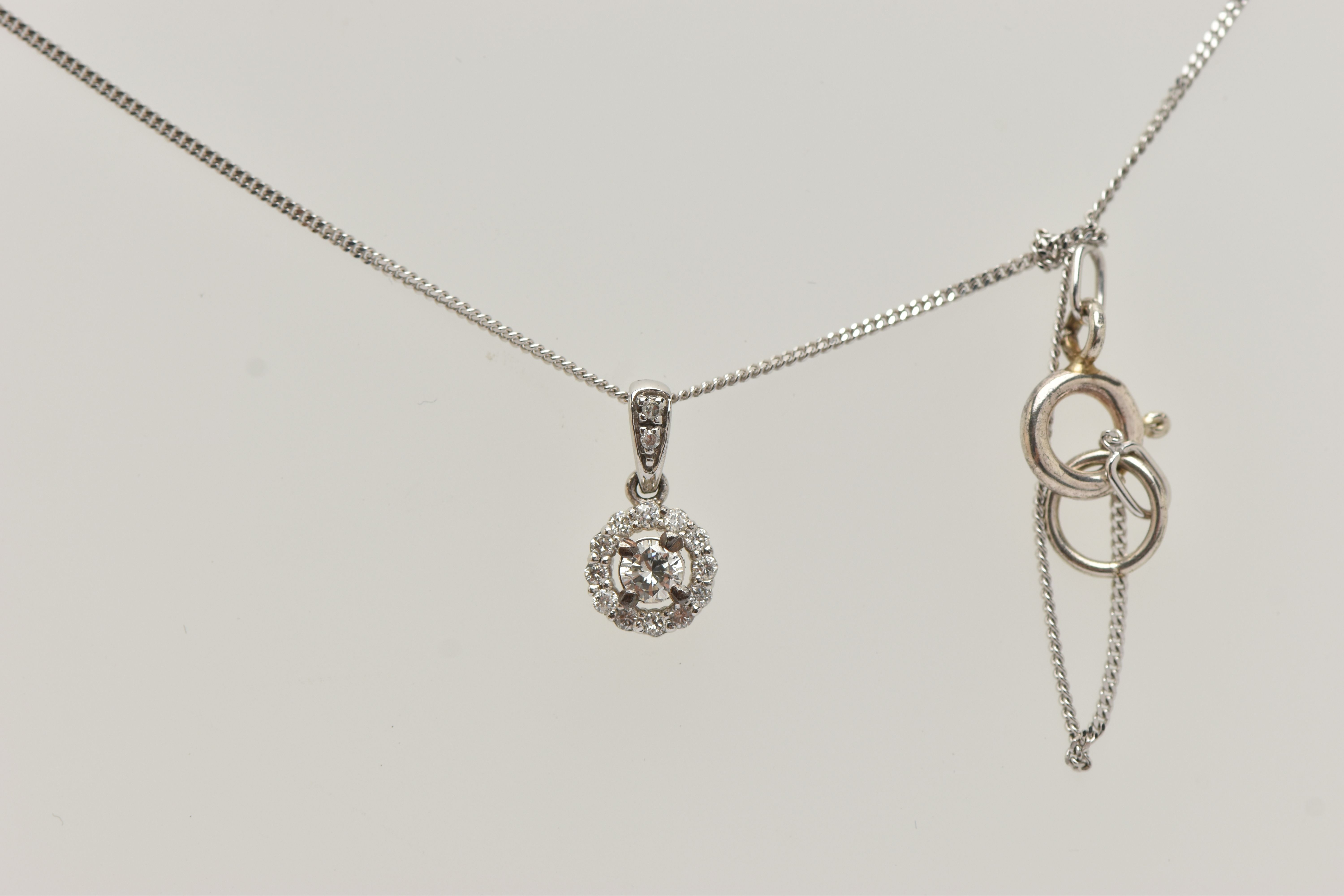 A 9CT WHITE GOLD DIAMOND PENDANT AND WHITE METAL CHAIN, a circular cluster pendant, set with a - Image 3 of 4