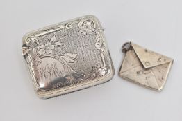 AN EARLY 20TH CENTURY SILVER VESTA AND STAMP CASE, the rectangular vesta with engraved scrolling
